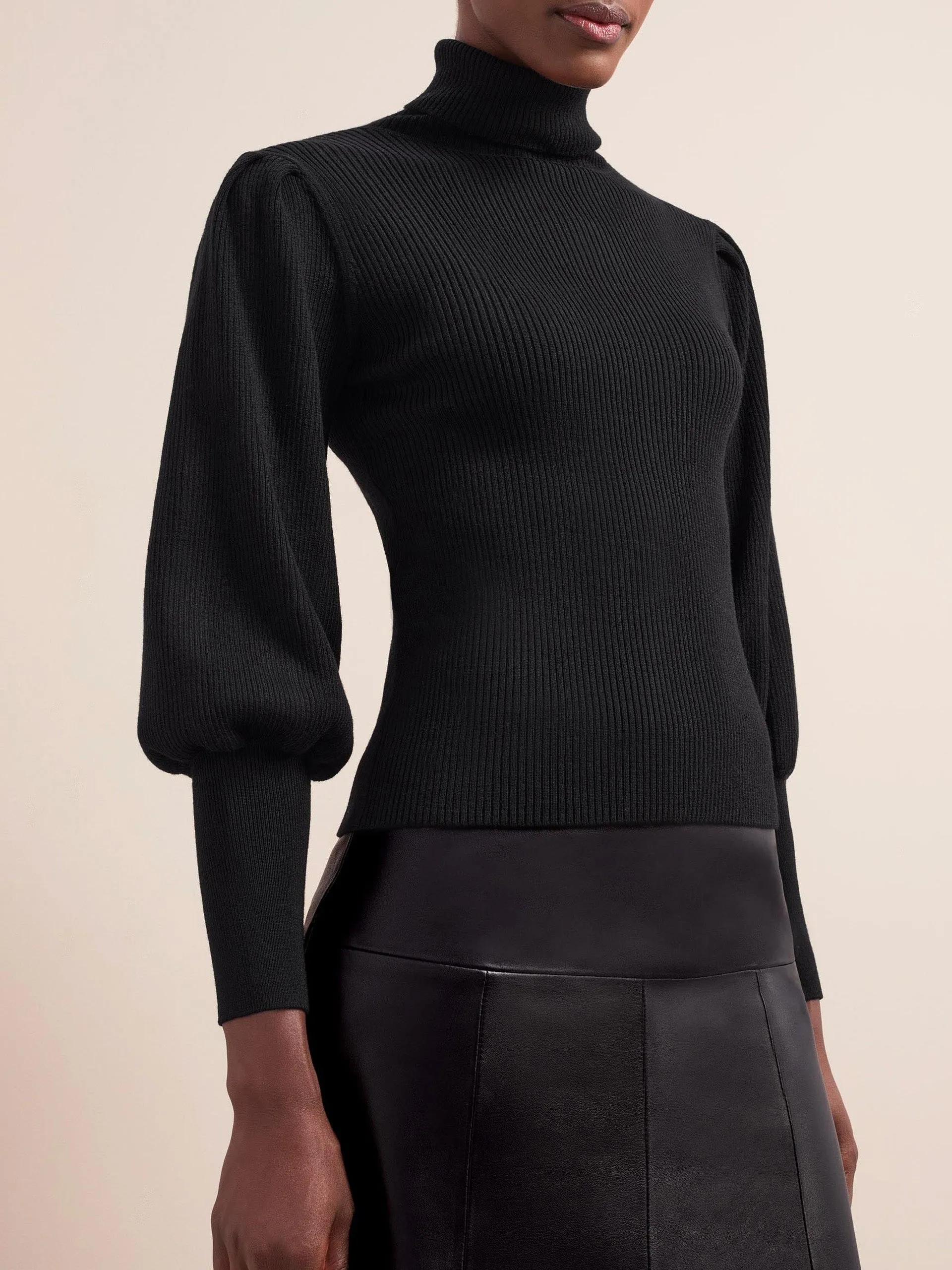 Black Eva wool roll neck jumper