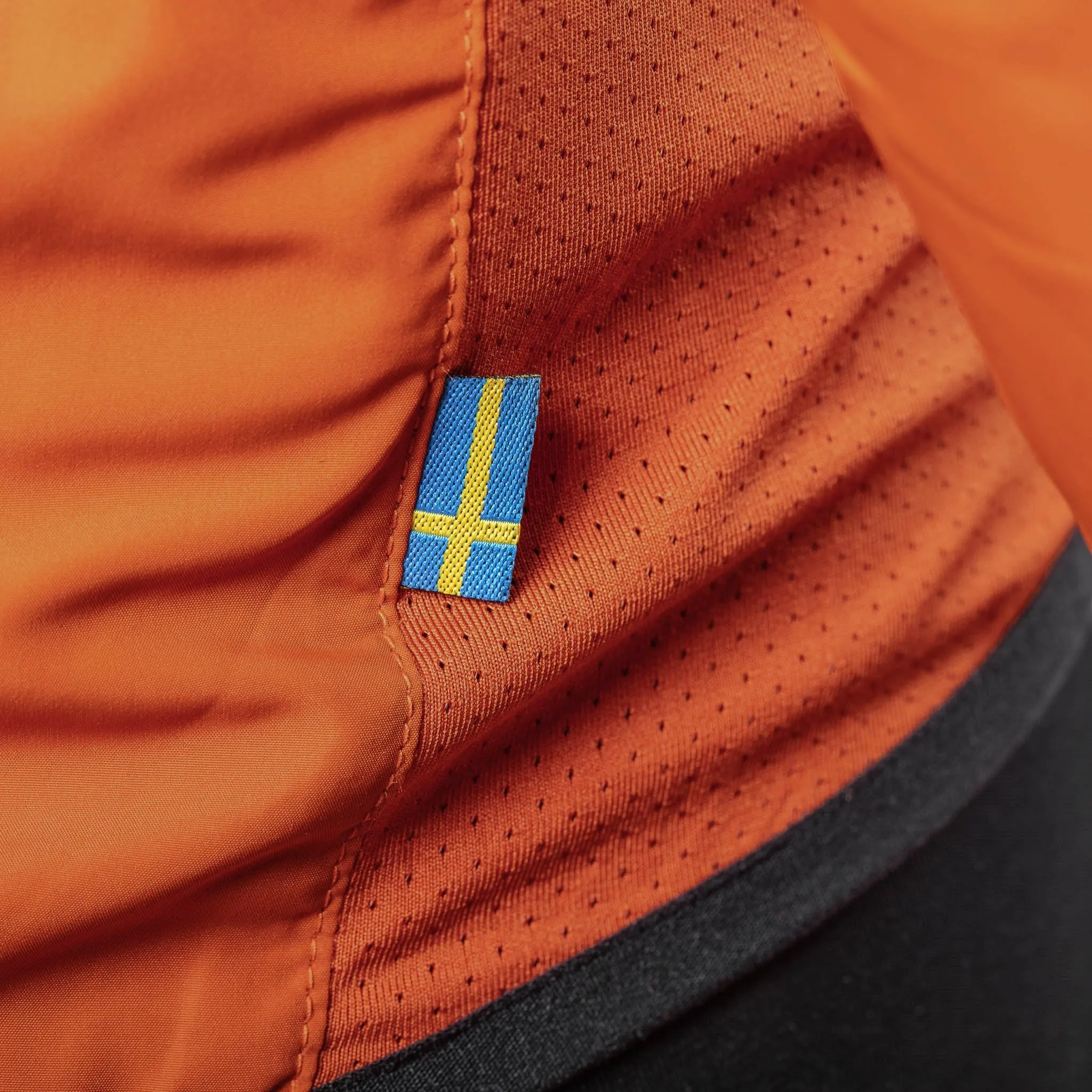 Treriksröset Orange - Cycling Pack Jacket for Men