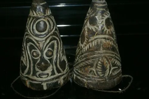 VERY RARE UNIQUE TERRACOTTA FEMALE BREASTS WITH FACES, ONCE PART OF AN ELABORATE CEREMONIAL TUMBUAN DANCE COSTUME WORN BY MEN TO IMPERSONATE WOMEN, SAWOS TRIBE, MIDDLE SEPIK RIVER, PAPUA NEW GUINEA, COLLECTED LATE 1900’S ON THE PREMISES